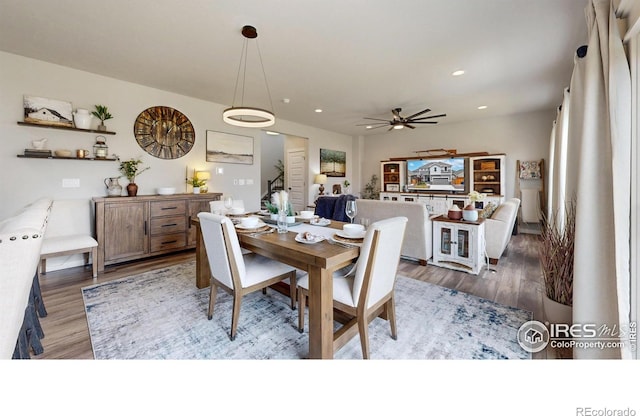 dining room featuring wood finished floors, a ceiling fan, and recessed lighting