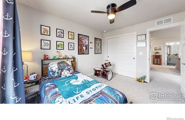 bedroom with carpet floors, a closet, and ceiling fan