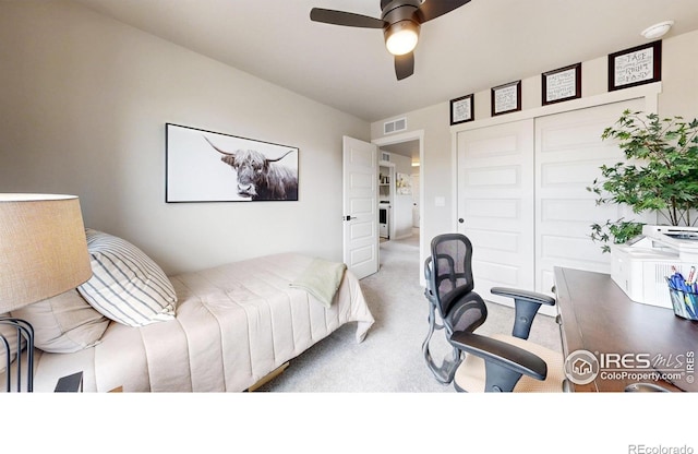 bedroom featuring carpet floors, a closet, and ceiling fan