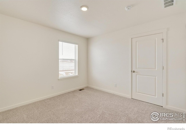 332 Hummingbird Ln, Johnstown, CO 80534 - spare room featuring carpet flooring, a smoke detector, and baseboards