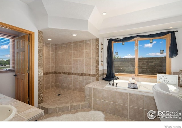 full bath with a bath, tiled shower, a sink, tile patterned floors, and recessed lighting