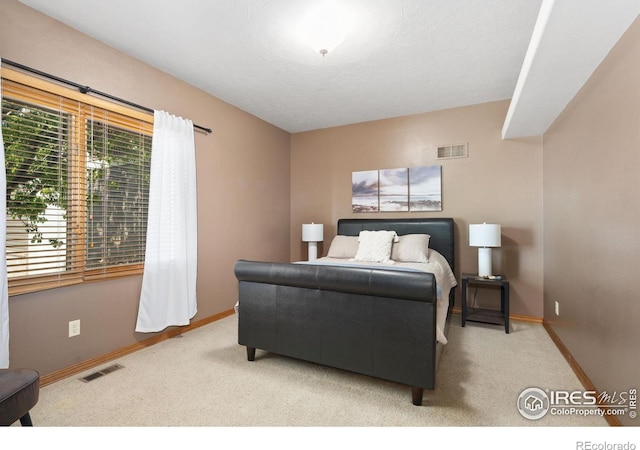 bedroom featuring carpet floors and baseboards