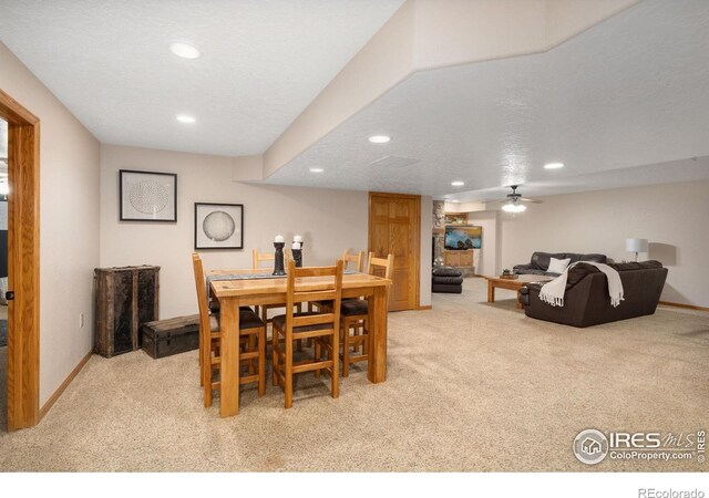 dining area featuring light carpet, recessed lighting, and baseboards