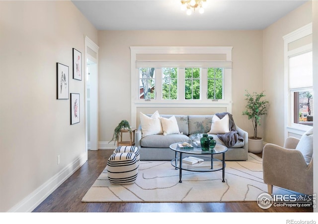 721 9th St, Boulder, CO 80302 - living area with healthy amount of natural light, wood finished floors, and baseboards