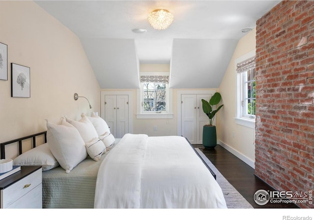 721 9th St, Boulder, CO 80302 - bedroom featuring dark wood-style floors, vaulted ceiling, multiple windows, and baseboards