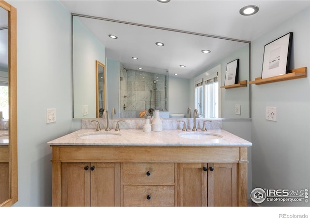 721 9th St, Boulder, CO 80302 - full bathroom with a shower stall, double vanity, and recessed lighting
