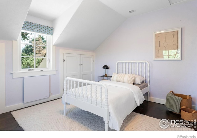 721 9th St, Boulder, CO 80302 - bedroom featuring wood finished floors, lofted ceiling, and baseboards