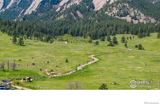 721 9th St, Boulder, CO 80302 - mountain view with rural landscape, a heavily wooded area, and a pastoral area