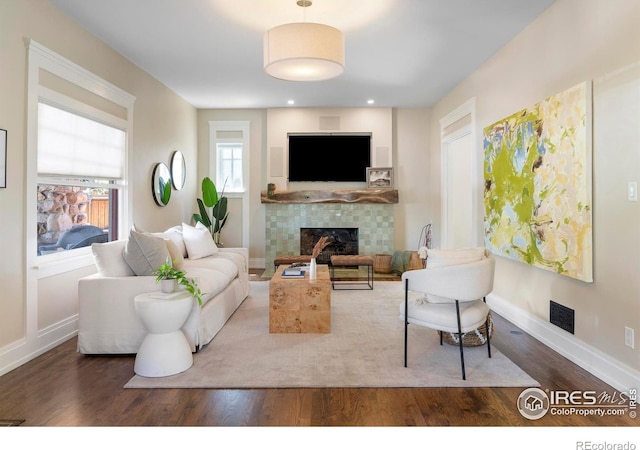 721 9th St, Boulder, CO 80302 - living area featuring a fireplace, wood finished floors, and baseboards