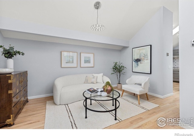 3075 Galena Way, Boulder, CO 80305 - living area with light wood finished floors, baseboards, and high vaulted ceiling