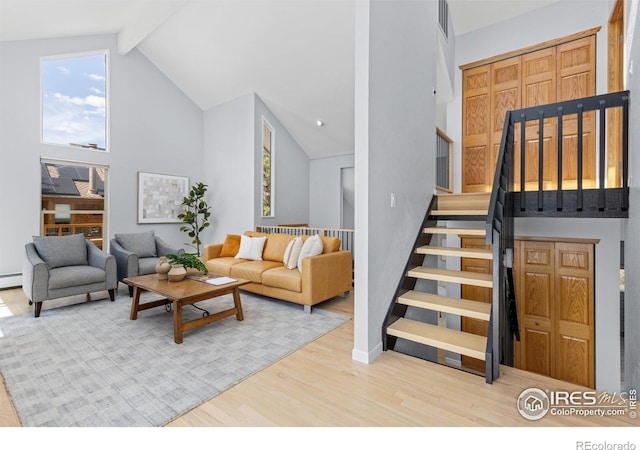 3075 Galena Way, Boulder, CO 80305 - living room featuring stairway, wood finished floors, high vaulted ceiling, beamed ceiling, and baseboards