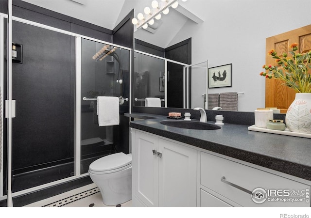 3075 Galena Way, Boulder, CO 80305 - bathroom with vanity, a stall shower, lofted ceiling, and toilet