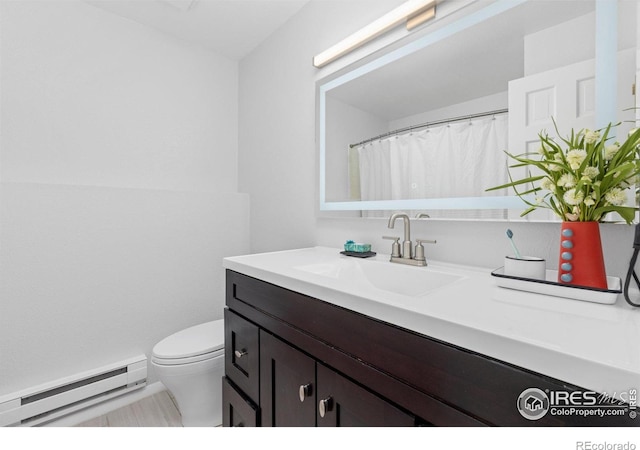 3075 Galena Way, Boulder, CO 80305 - full bath featuring baseboard heating, vanity, and toilet