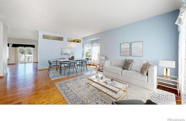 4447 Twin Peaks Dr, Loveland, CO 80537 - living room featuring hardwood / wood-style floors and baseboards