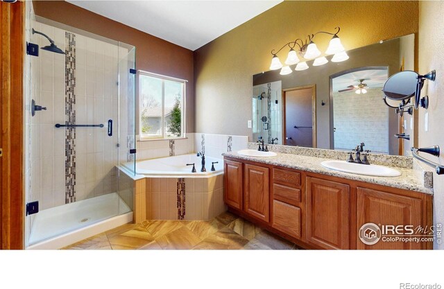 4447 Twin Peaks Dr, Loveland, CO 80537 - full bath with a shower stall, a bath, ceiling fan, and double vanity
