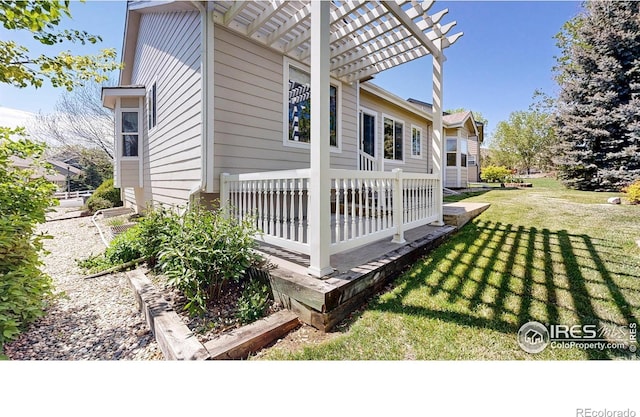 4447 Twin Peaks Dr, Loveland, CO 80537 - view of side of home featuring a yard and a pergola