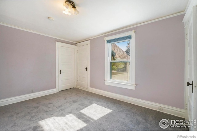 486 N Corona St, Denver, CO 80218 - carpeted empty room featuring ornamental molding, a smoke detector, and baseboards