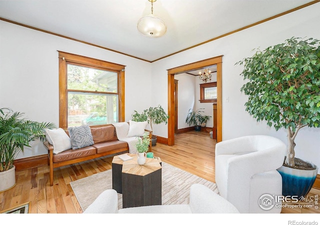 486 N Corona St, Denver, CO 80218 - living area with baseboards, crown molding, a chandelier, healthy amount of natural light, and wood finished floors