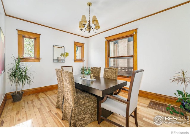 486 N Corona St, Denver, CO 80218 - dining area featuring baseboards, a chandelier, light wood-style floors, and ornamental molding