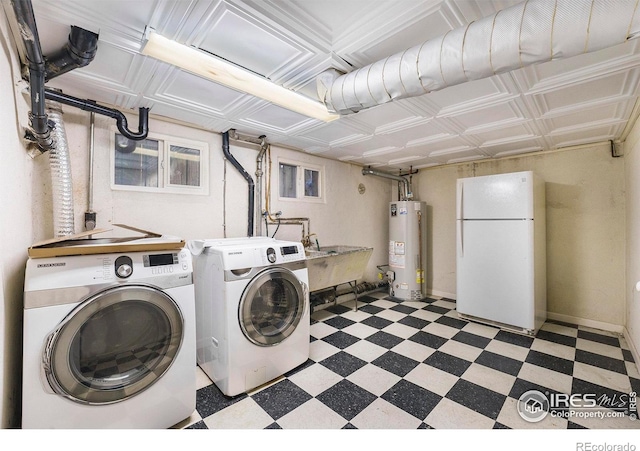 486 N Corona St, Denver, CO 80218 - laundry area featuring washer and clothes dryer, water heater, and tile patterned floors