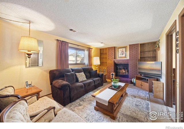 127 Lori Dr, Loveland, CO 80537 - living room with a textured ceiling, a fireplace, carpet flooring, and built in features