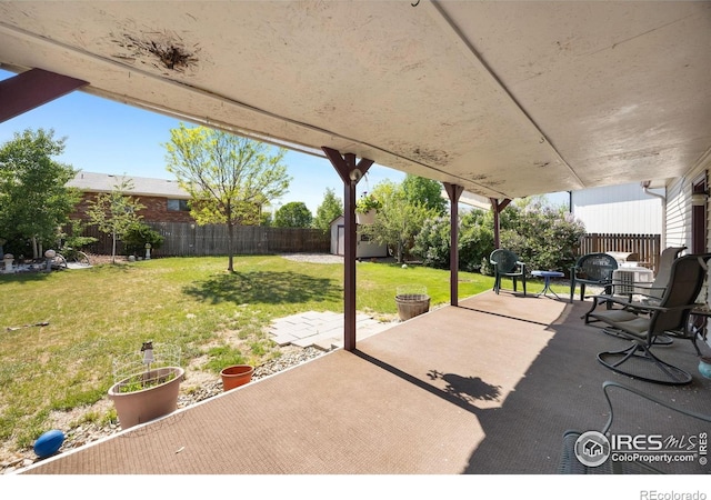 127 Lori Dr, Loveland, CO 80537 - view of patio / terrace with a shed and an outdoor structure