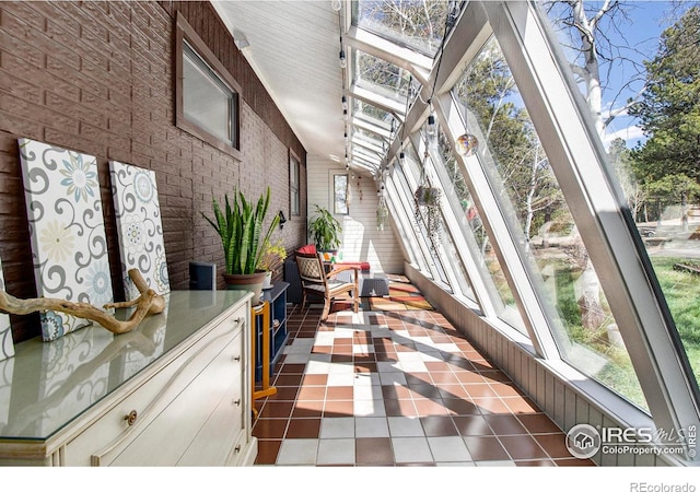 133 Rockledge Cir, Allenspark, CO 80540 - sunroom / solarium featuring tile patterned flooring and brick wall