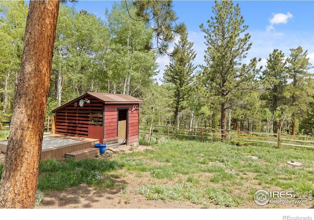 133 Rockledge Cir, Allenspark, CO 80540 - view of yard featuring an outbuilding and a wooden deck