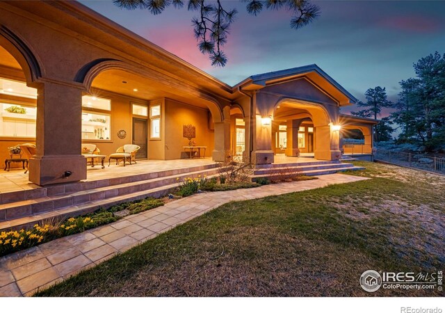 3005 Grey Fox Dr, Estes Park, CO 80517 - back of house with a porch and stucco siding