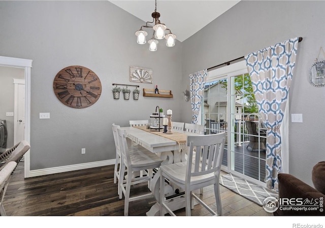 2015 Trail Ridge Dr, Severance, CO 80615 - dining room with wood finished floors, high vaulted ceiling, baseboards, and a chandelier