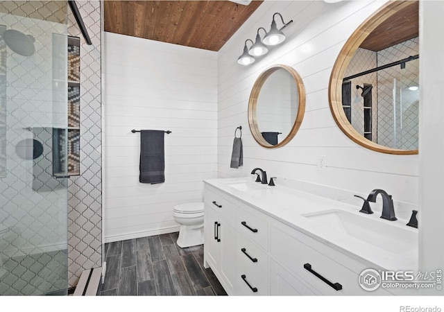 2015 Trail Ridge Dr, Severance, CO 80615 - full bath featuring wooden ceiling, a shower stall, wood tiled floors, toilet, and double vanity