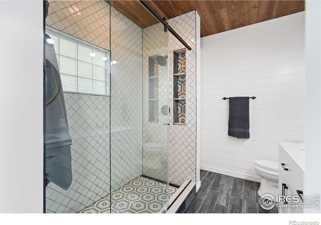 2015 Trail Ridge Dr, Severance, CO 80615 - full bath featuring wood finished floors, wood ceiling, a stall shower, toilet, and vanity