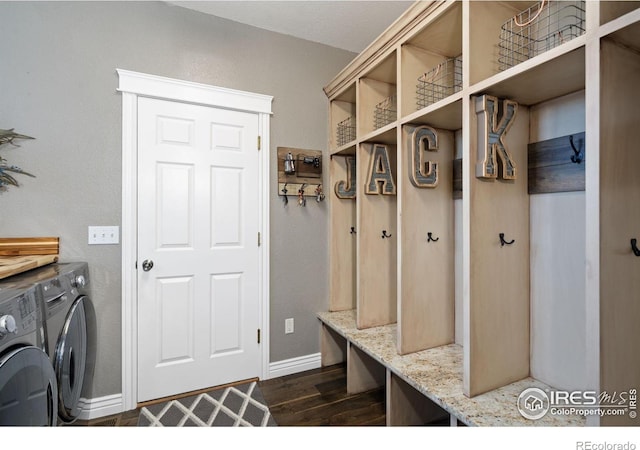 2015 Trail Ridge Dr, Severance, CO 80615 - mudroom featuring separate washer and dryer, dark wood-type flooring, and baseboards