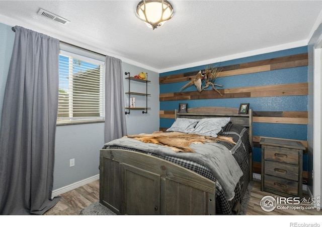 2015 Trail Ridge Dr, Severance, CO 80615 - bedroom featuring wood finished floors and baseboards
