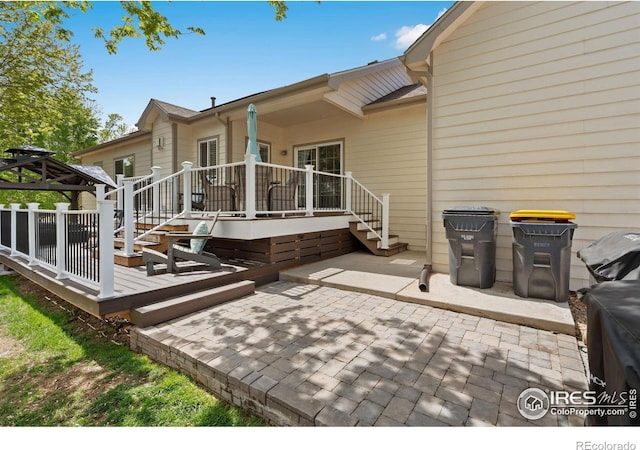 2015 Trail Ridge Dr, Severance, CO 80615 - rear view of house with a patio area, a gazebo, and a deck