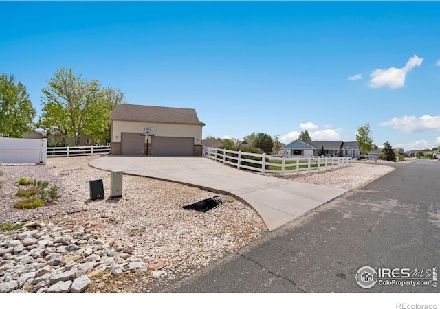 2015 Trail Ridge Dr, Severance, CO 80615 - view of front of home with fence and concrete driveway