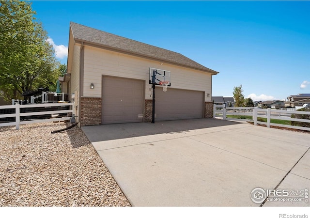 2015 Trail Ridge Dr, Severance, CO 80615 - view of home's exterior featuring brick siding and fence