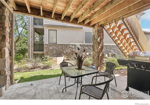 view of patio / terrace with stairs and grilling area