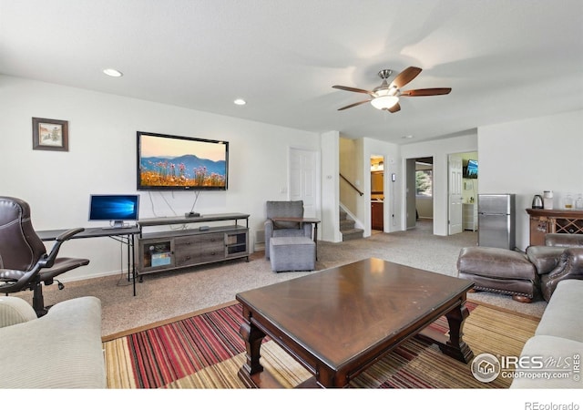 carpeted living room with stairway, a ceiling fan, an office area, recessed lighting, and baseboards