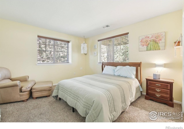 carpeted bedroom with baseboards