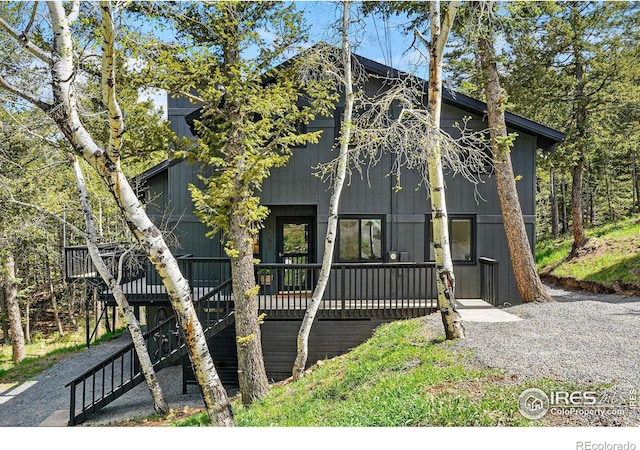 1750 Deer Trail Rd, Boulder, CO 80302 - view of front facade with stairs and a deck