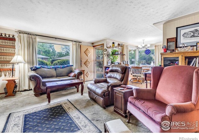1235 Lincoln St, Longmont, CO 80501 - carpeted living room featuring a chandelier, plenty of natural light, and a textured ceiling