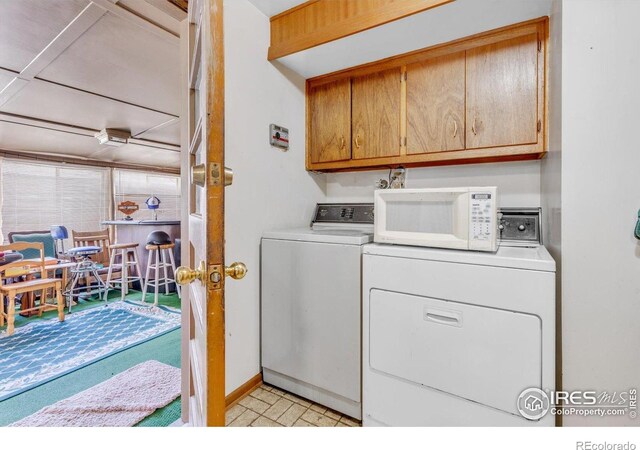 1235 Lincoln St, Longmont, CO 80501 - clothes washing area featuring cabinet space and separate washer and dryer