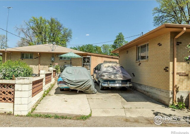 1235 Lincoln St, Longmont, CO 80501 - view of side of home featuring brick siding