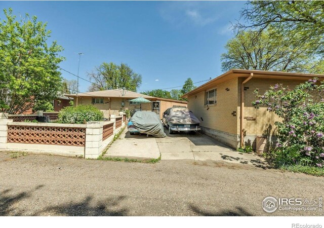 1235 Lincoln St, Longmont, CO 80501 - view of home's exterior with fence