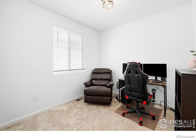 office space with carpet and baseboards