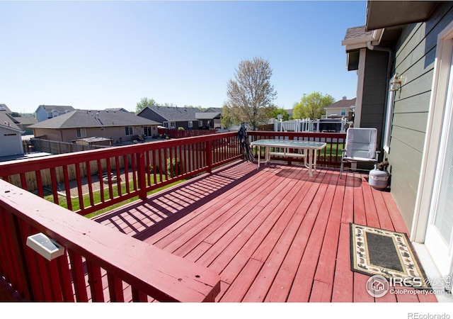 1734 68th Ave, Greeley, CO 80634 - wooden terrace with a residential view and a fenced backyard