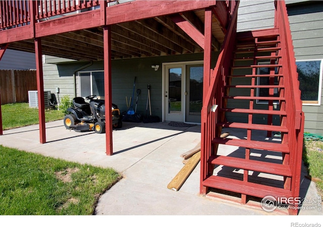 1734 68th Ave, Greeley, CO 80634 - view of patio / terrace with cooling unit, stairway, a wooden deck, and fence