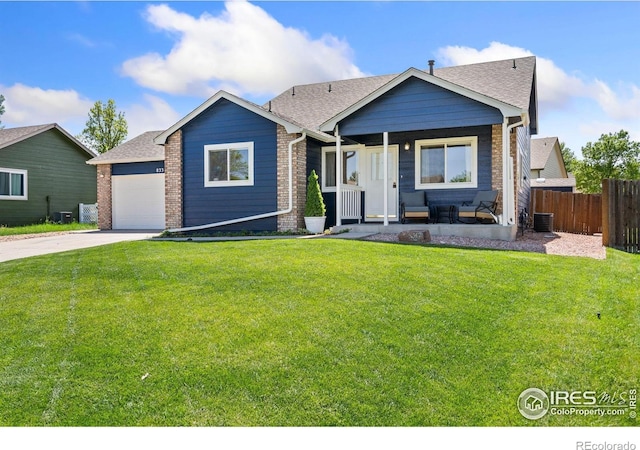 833 Kaitlyn Cir, Loveland, CO 80537 - single story home with covered porch, brick siding, central AC, concrete driveway, and an attached garage