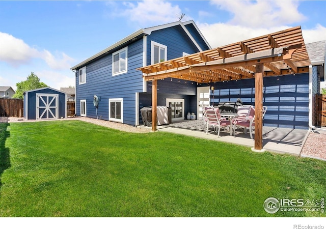 833 Kaitlyn Cir, Loveland, CO 80537 - rear view of property featuring a shed, a pergola, a patio, and an outbuilding